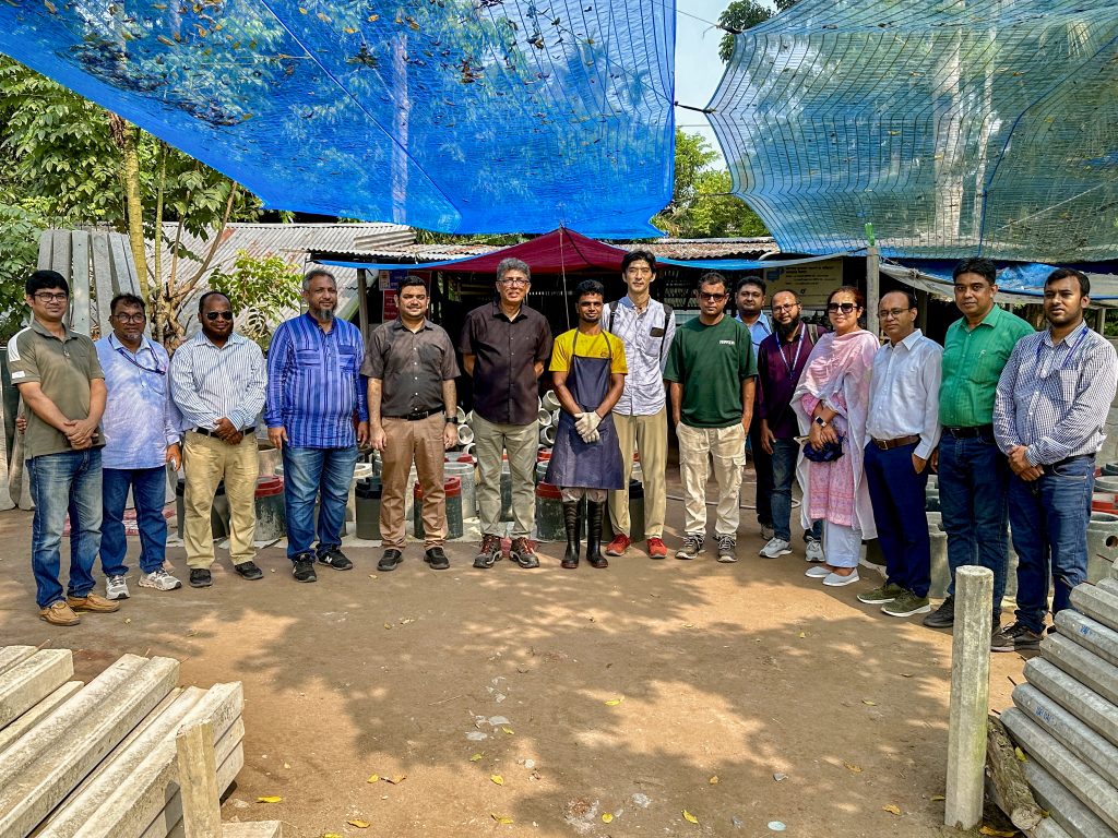 World Bank environmental specialist examines environmental management practices at a block and paving tile manufacturing facility under the SMART project.