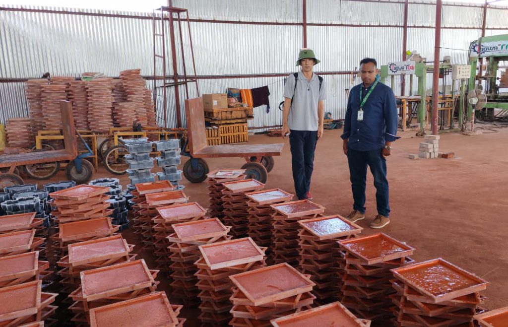 World Bank and PKSF representatives inspect resource-efficient production technologies at a SMART-supported block and paving tile factory in southwestern Bangladesh.
