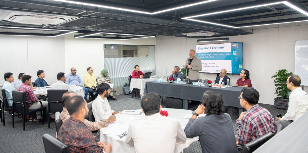 Officials from SMART project Partner Organizations participate in a practical photography and visual storytelling session during a training workshop organized by PKSF.